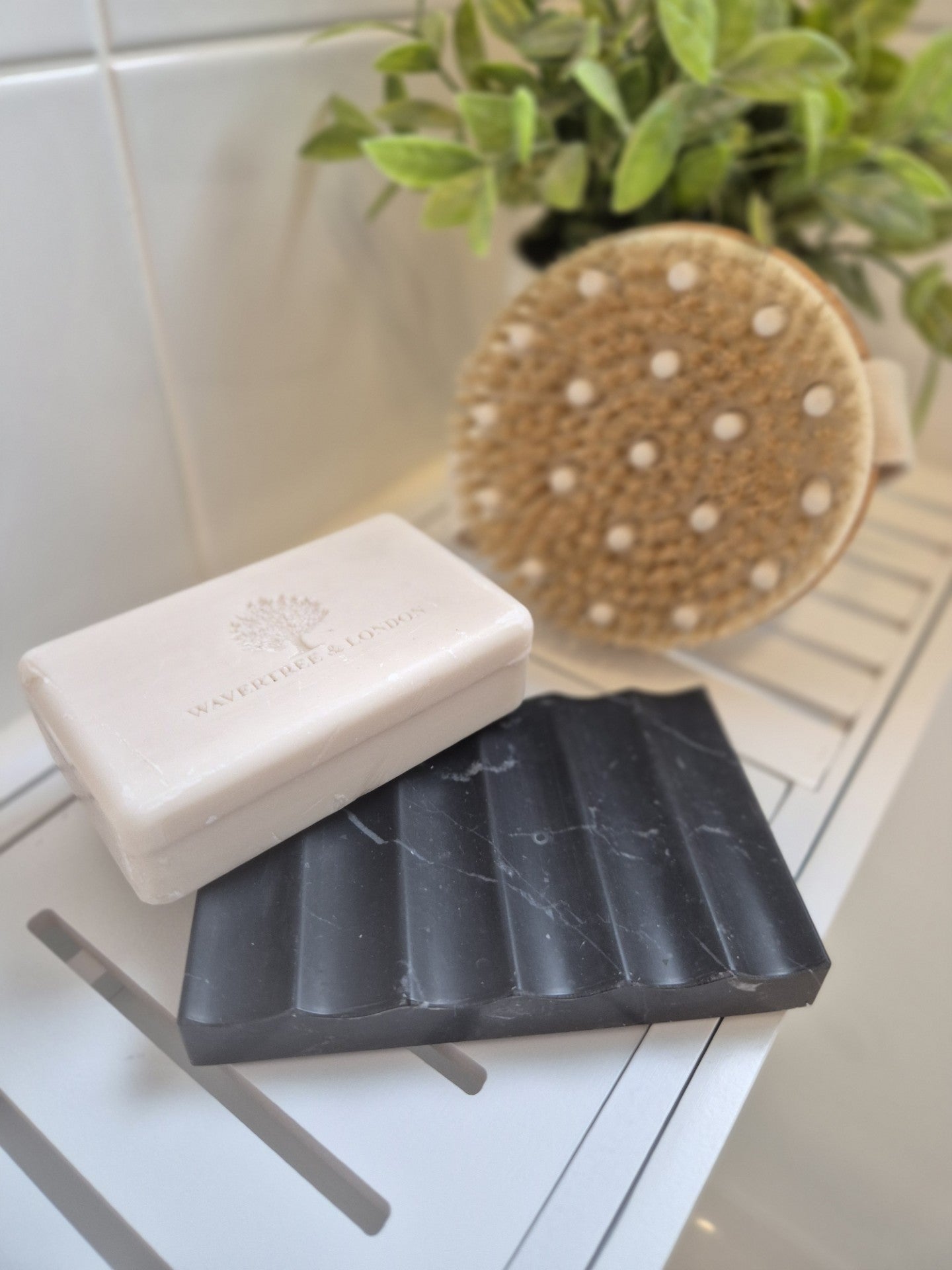 Black marble soap dish in laundry