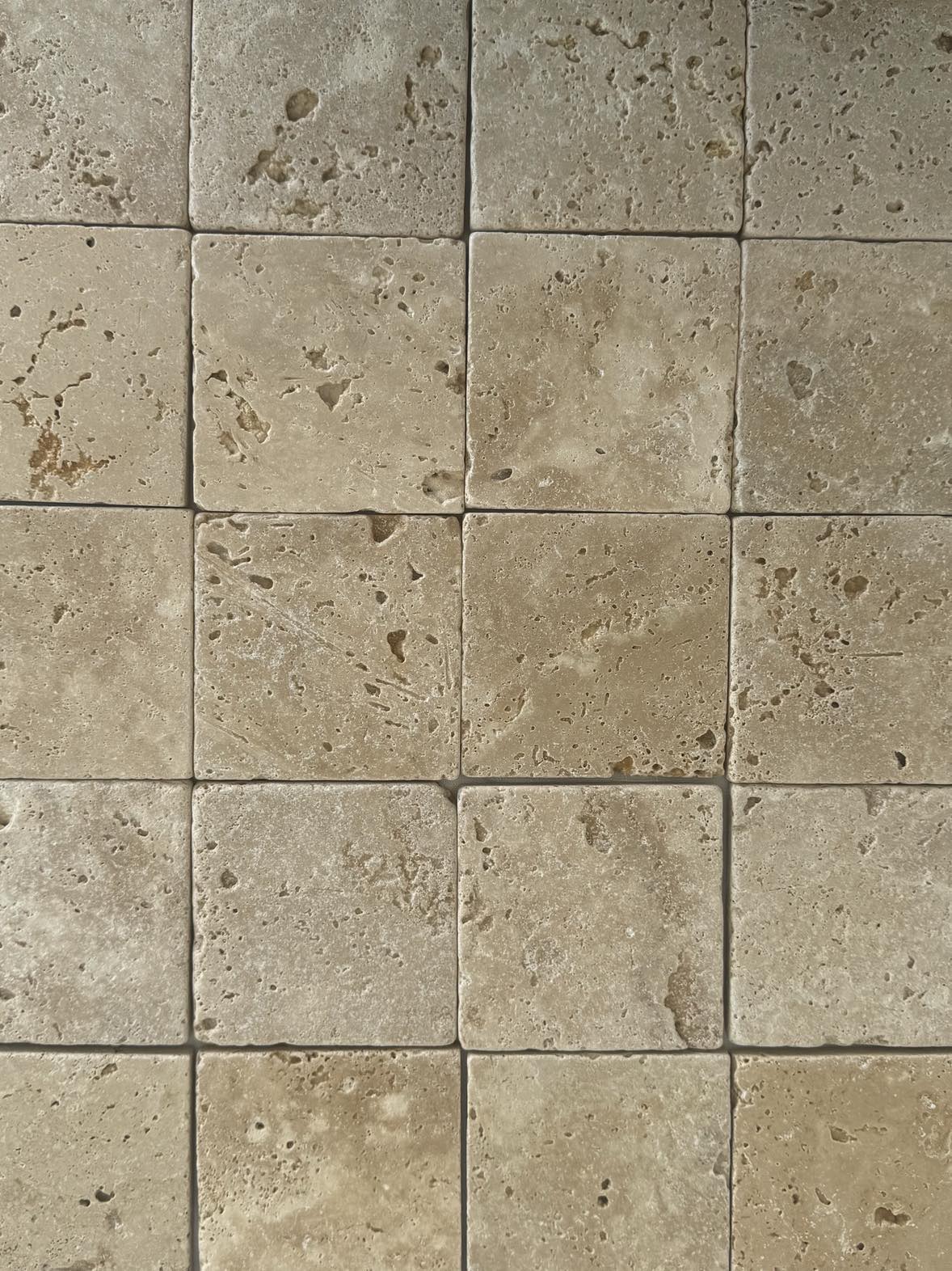 Square travertine coaster with textured surface, boho wedding gift