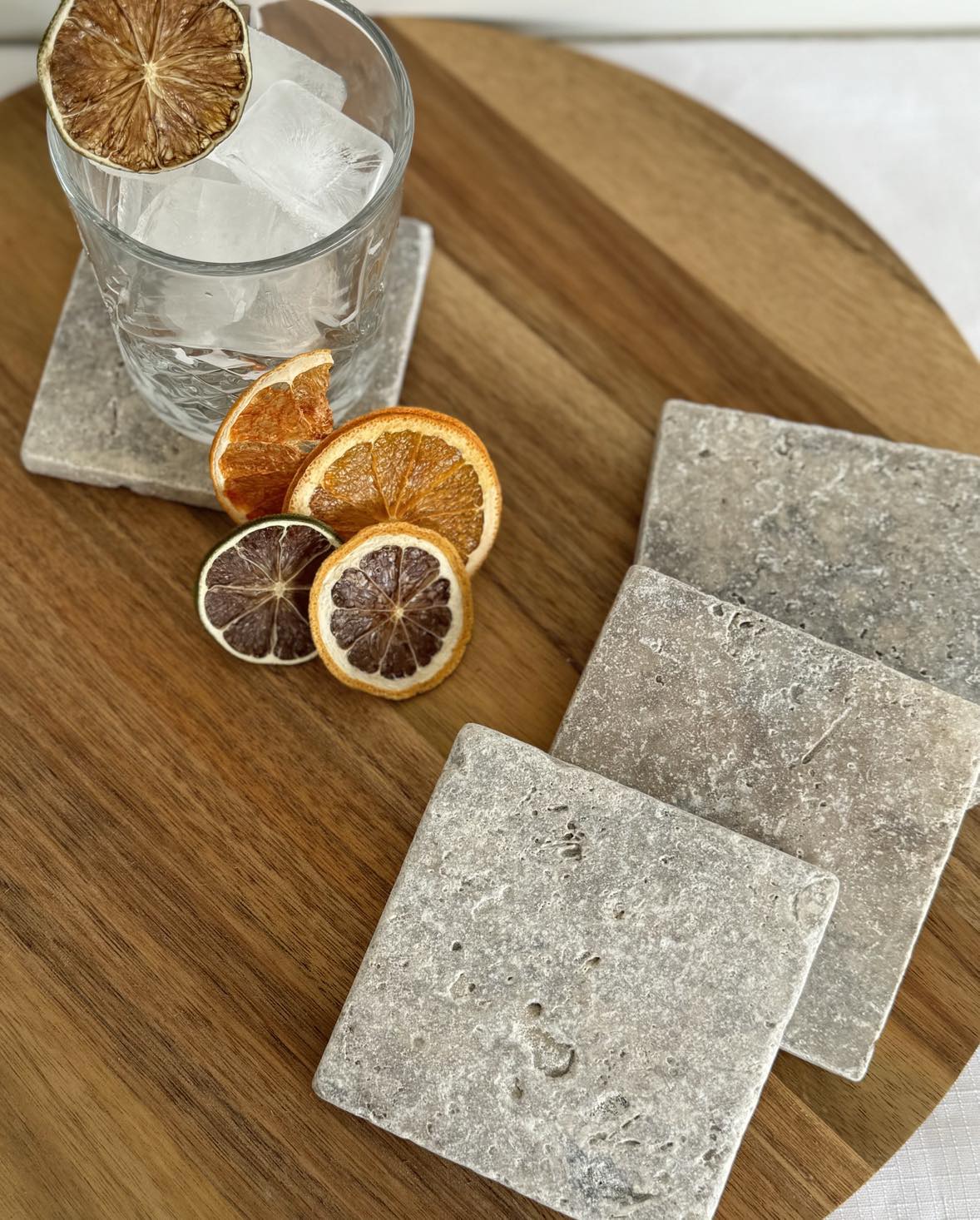 Silver travertine coaster with grey tones and natural veining
