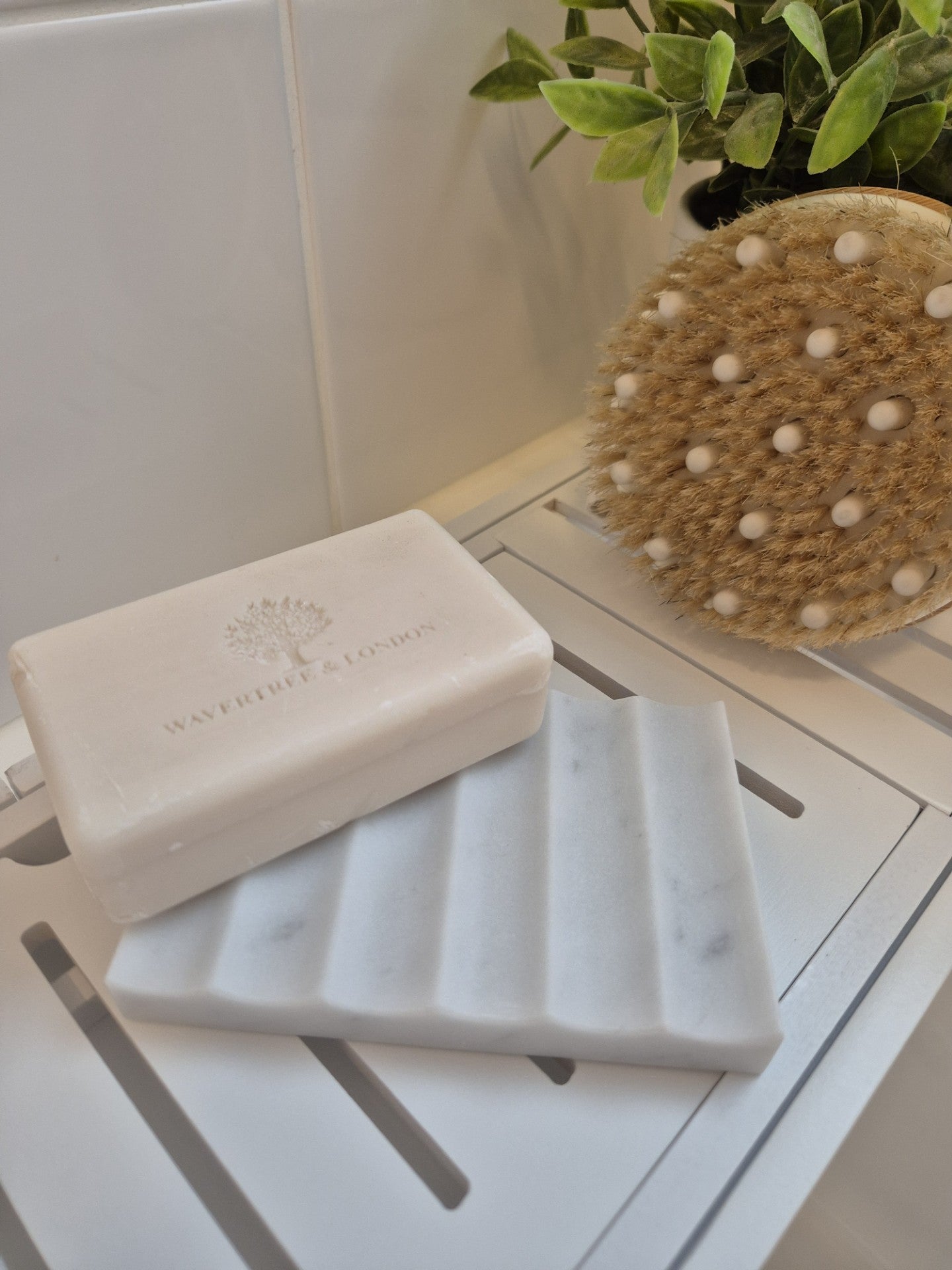 White marble ridged soap holder with cake soap 