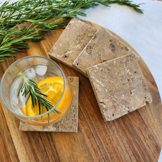 Set of 4 Noce travertine coasters with earthy brown finish